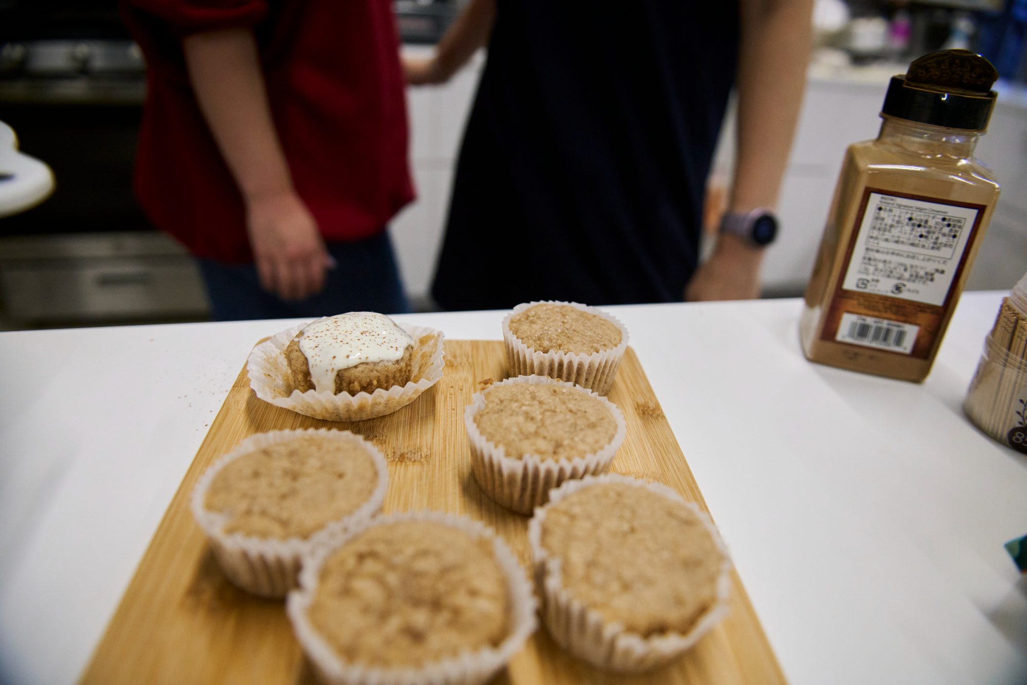 A tray of freshly baked muffins on a café counter