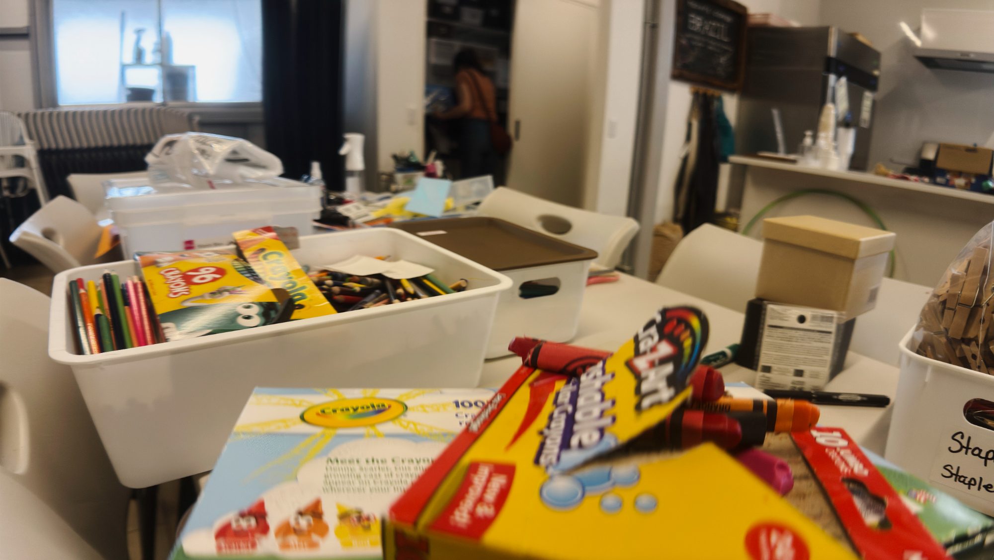Boxes of snacks and supplies stacked on a table