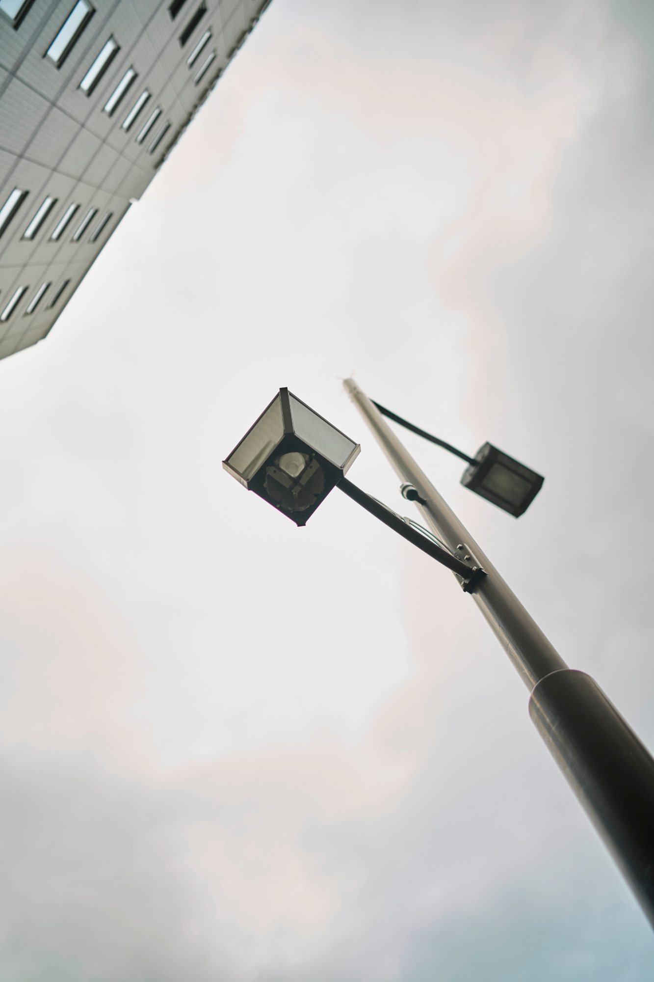 A streetlamp against a pale morning sky