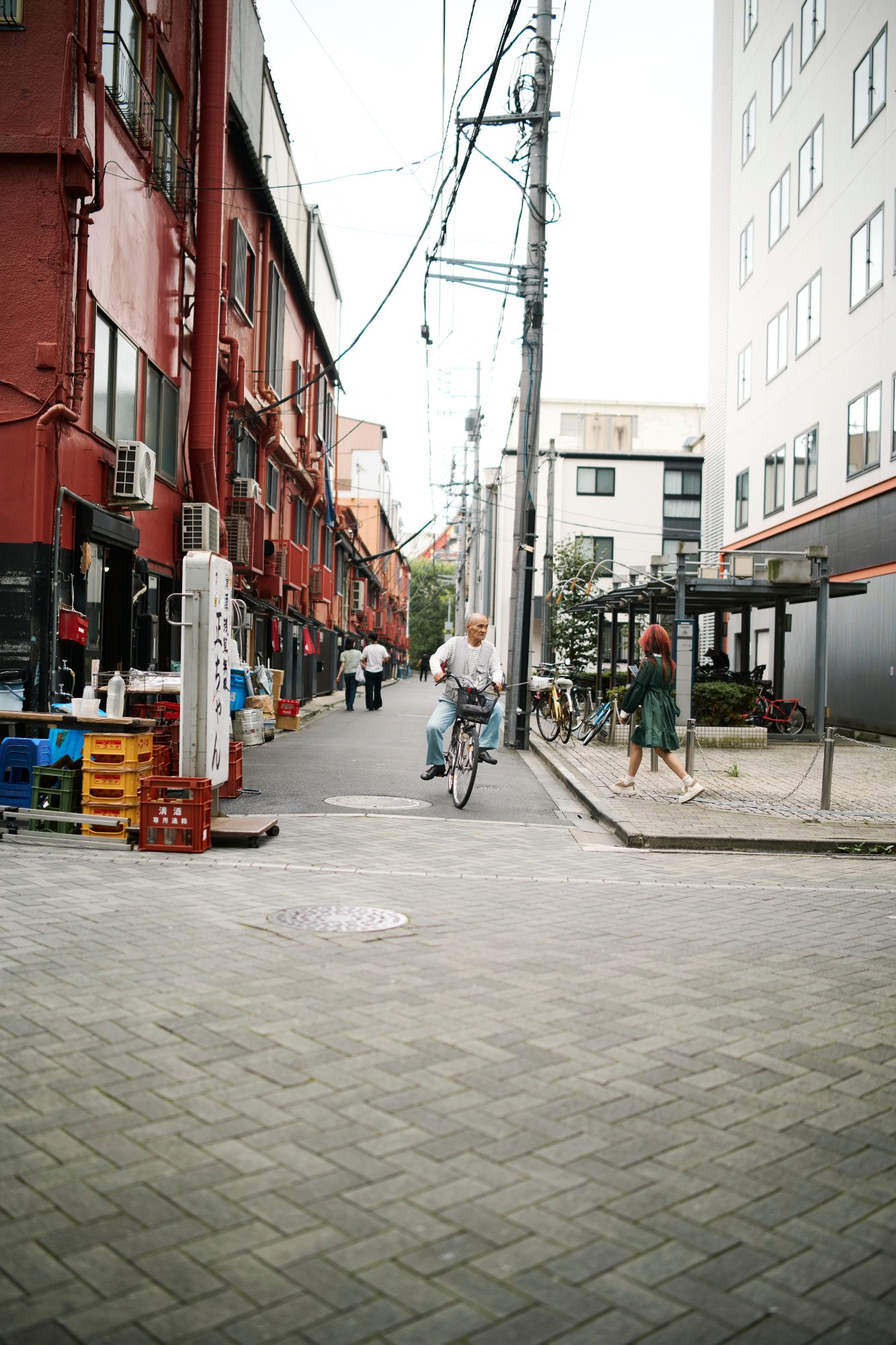 A quiet brick-paved street lined with low shops