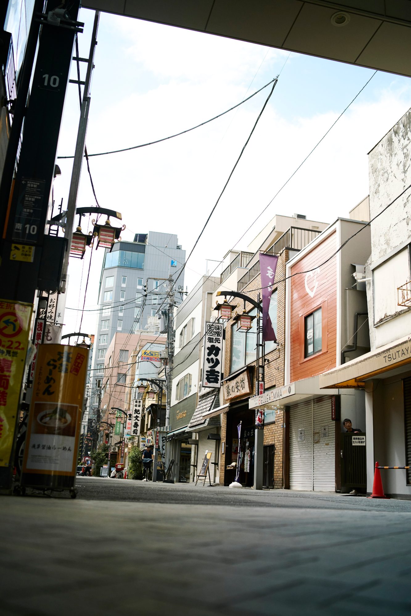 A long, empty shopping street in the morning