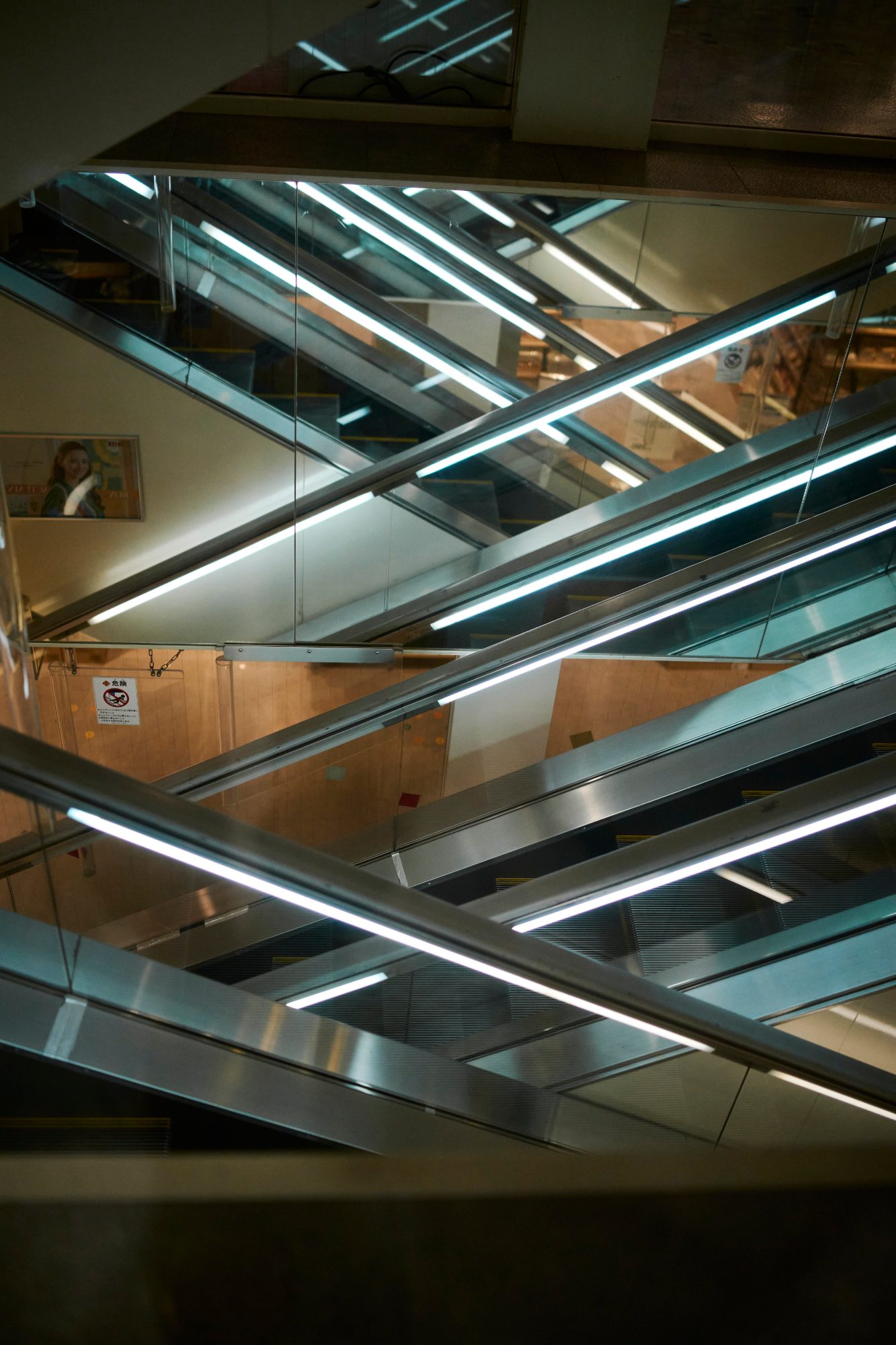 Layers of escalators inside a station atrium