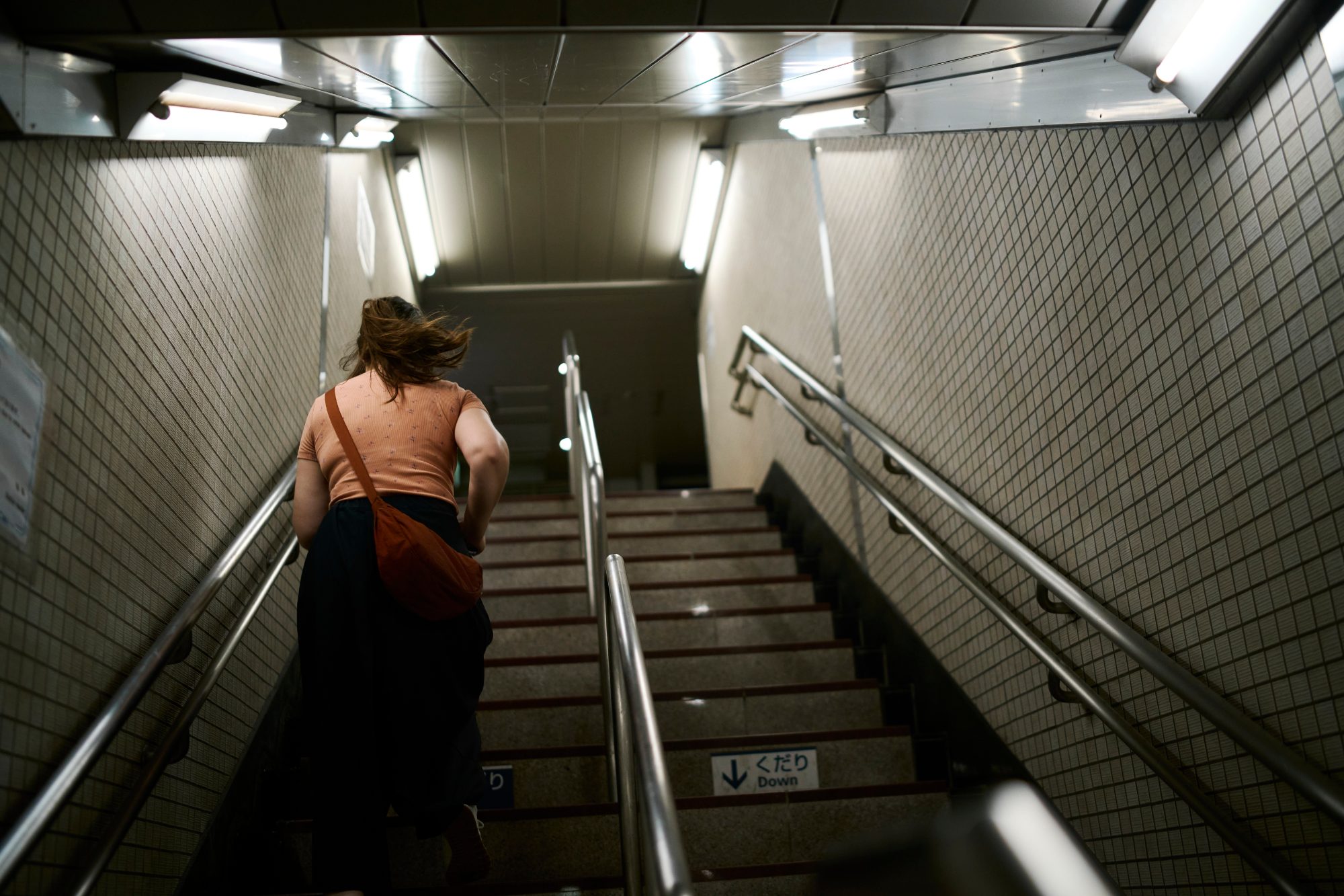 Climbing the stairs out of a subway station