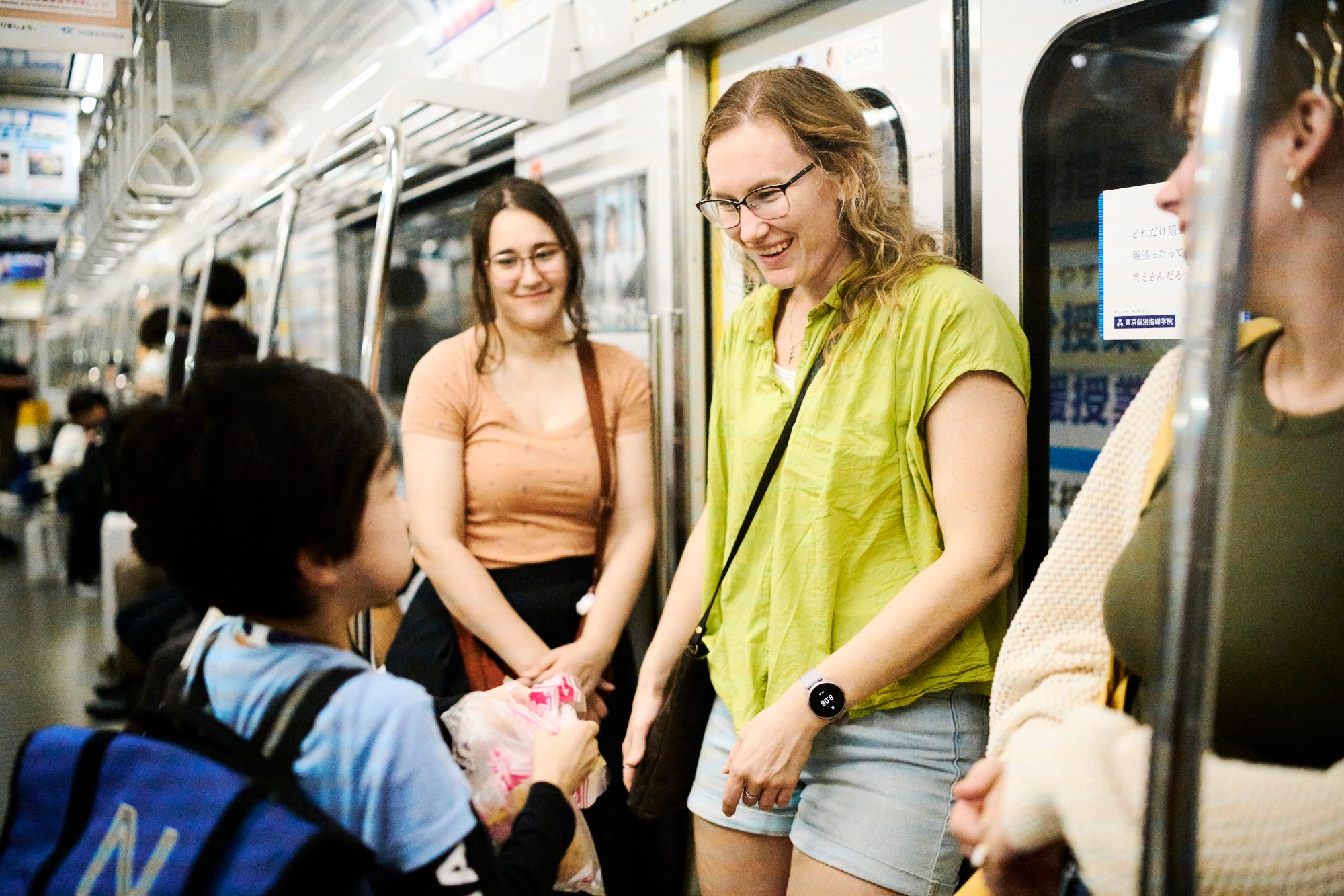 Friends laughing together on the train home