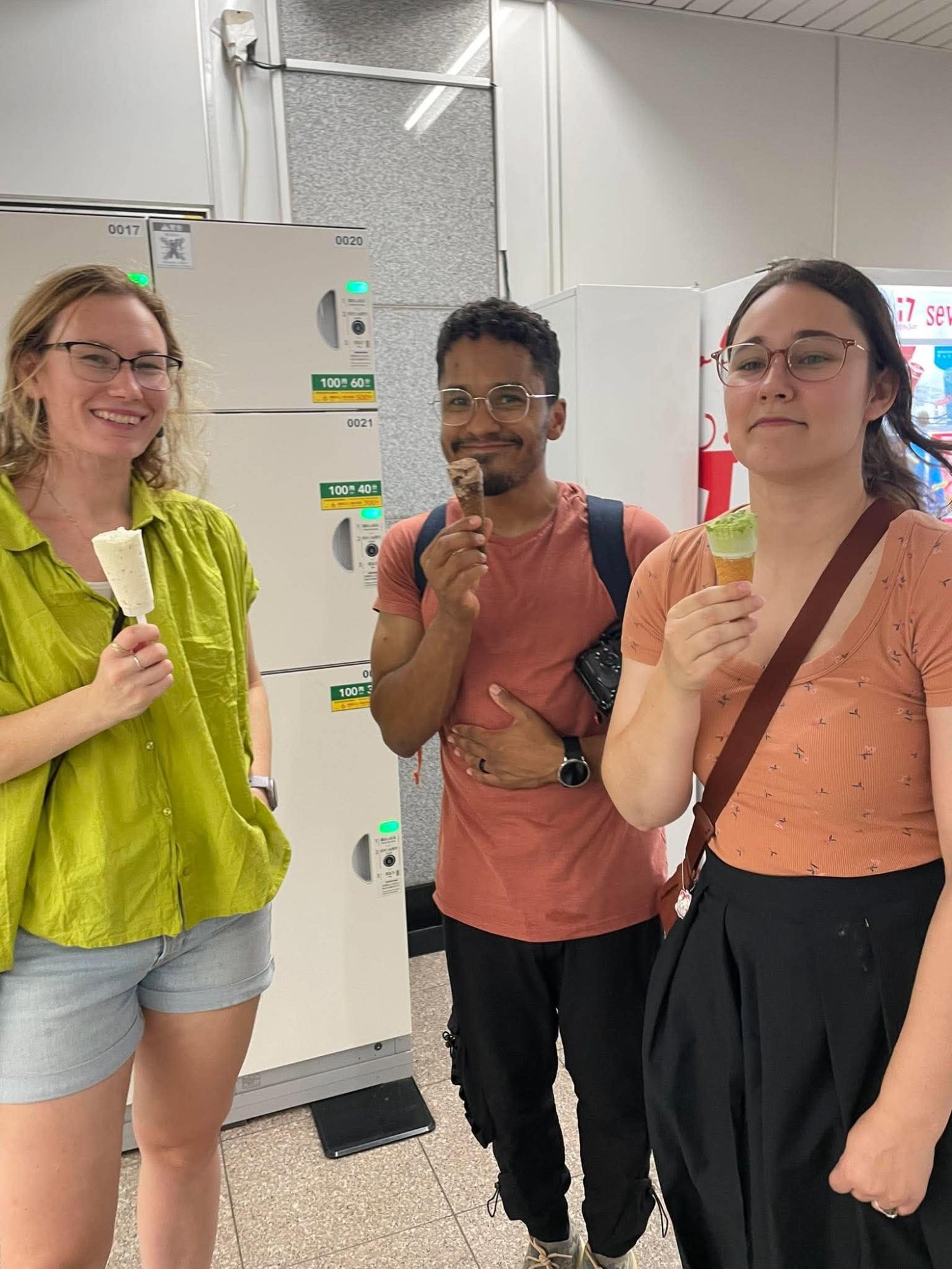 Three friends with ice cream in a convenience store